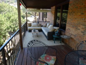 Deck complete with settee and dining table - guess they don't get much rain.